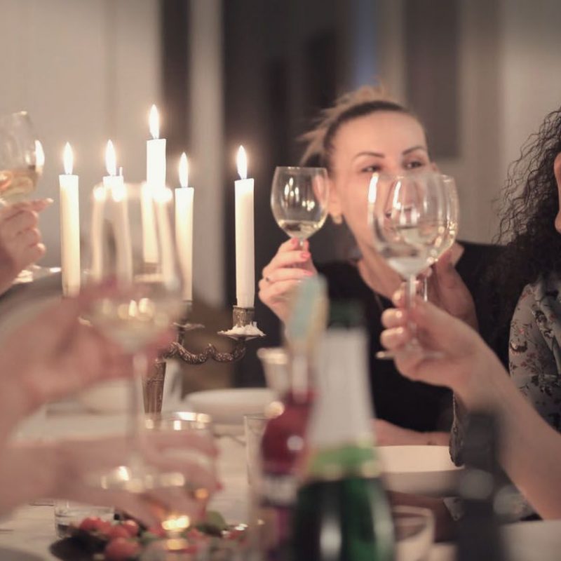 friends tasting wine at home