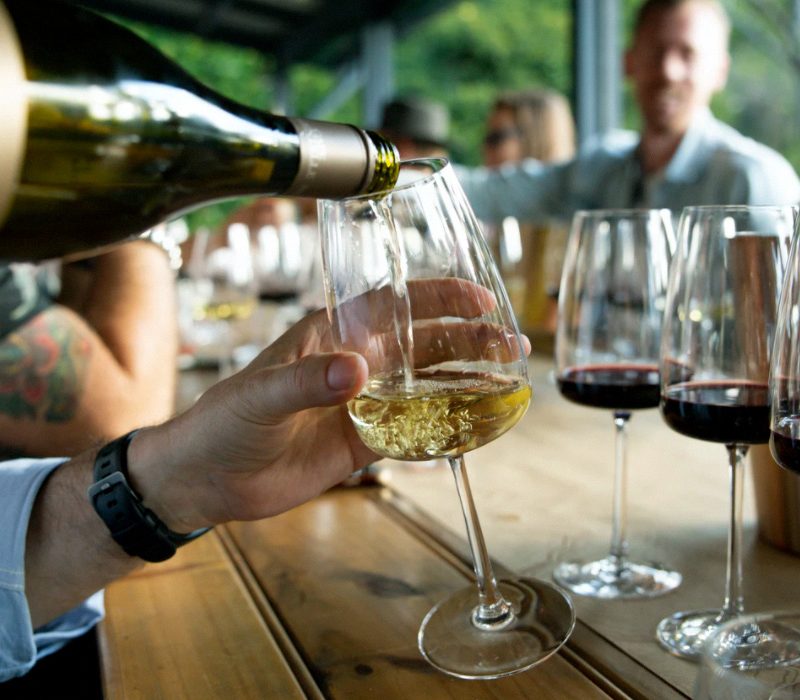 Customers Enjoying Wine at Bar