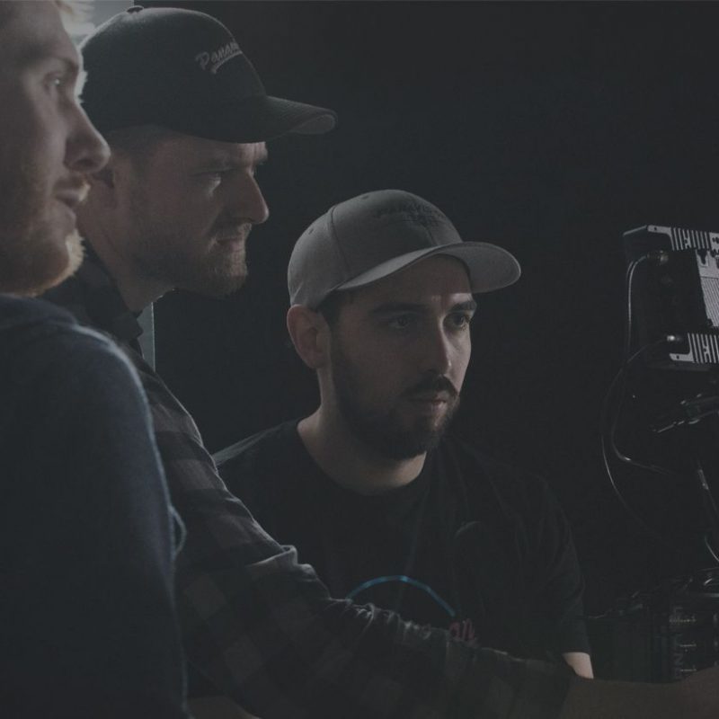 pour agency reviewing video on camera