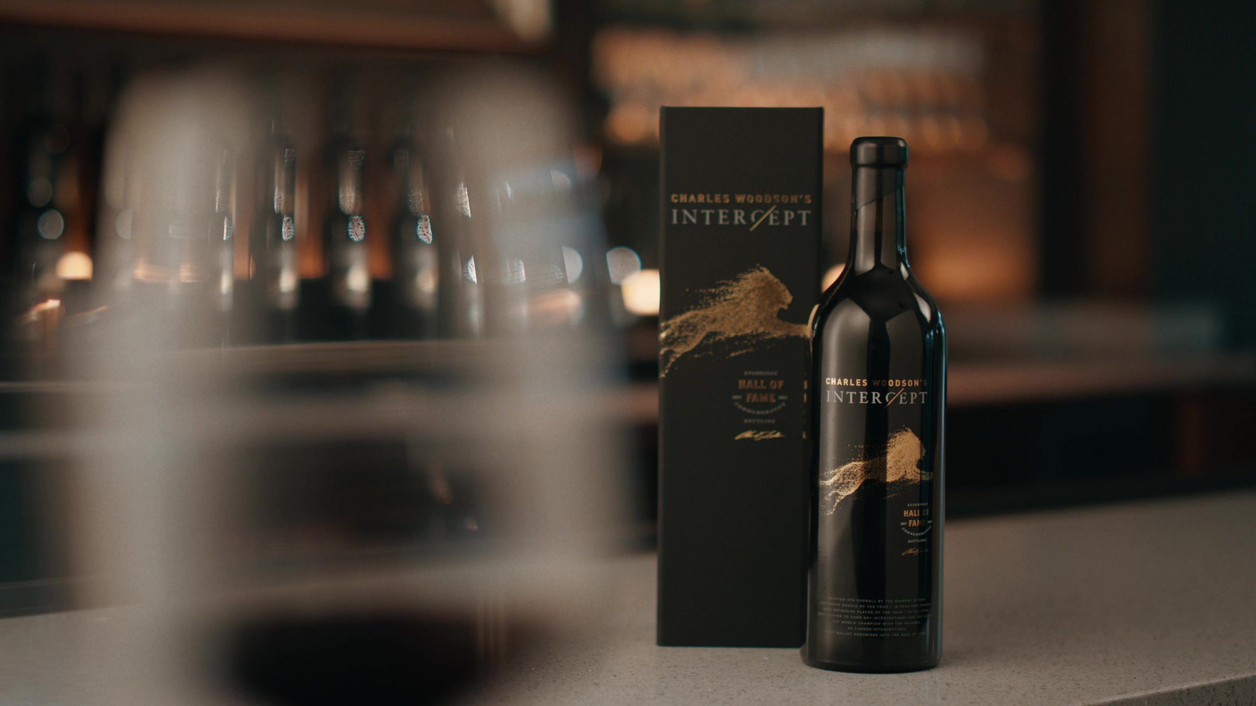 A bottle of wine labeled 'Charles Woodson's Intercept Hall of Fame'.