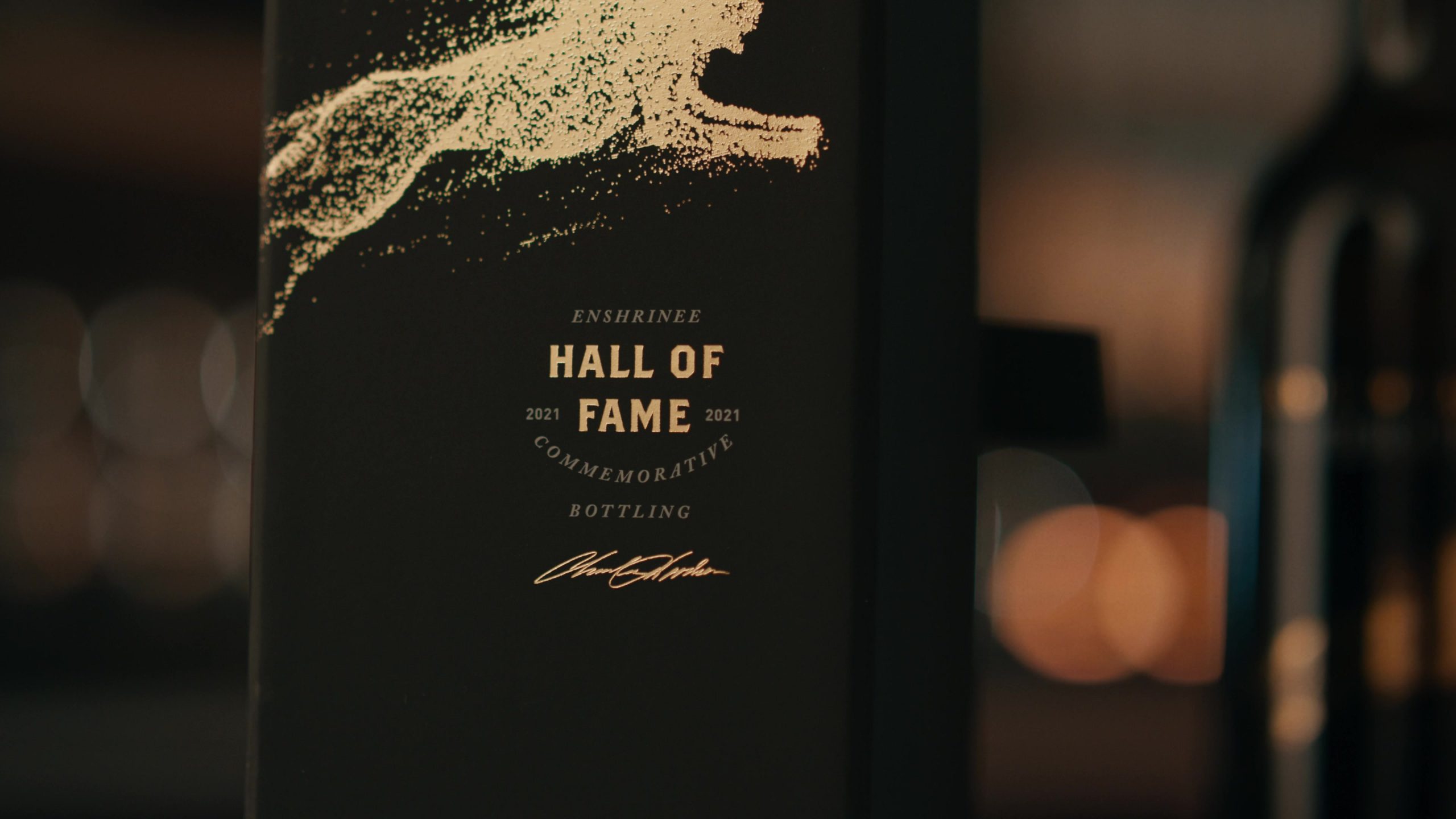 Close-up view of a Charles Woodson's Intercept Wine Hall of Fame commemorative bottle.