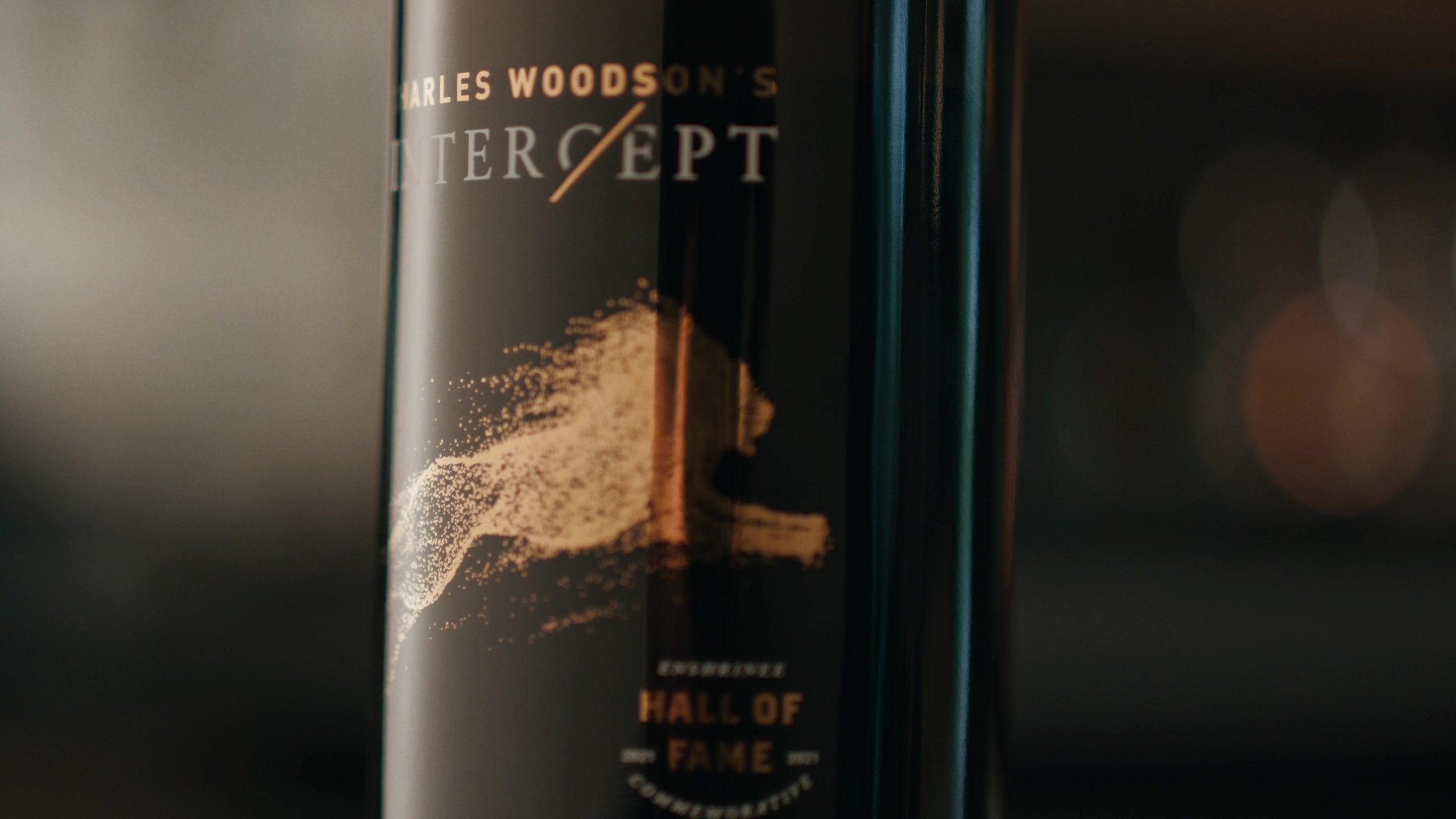 Close-up view of a Charles Woodson's Intercept Wine bottle.