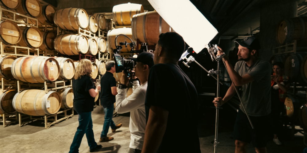 An audiovisual production team working with lights and cameras.