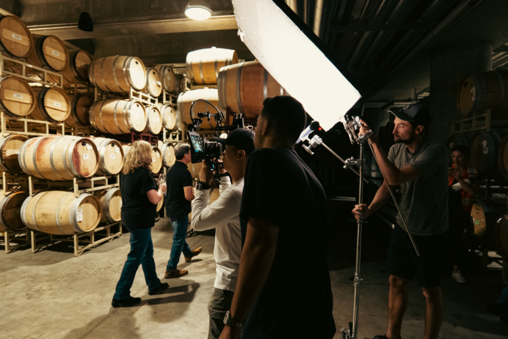An audiovisual production team working with lights and cameras.